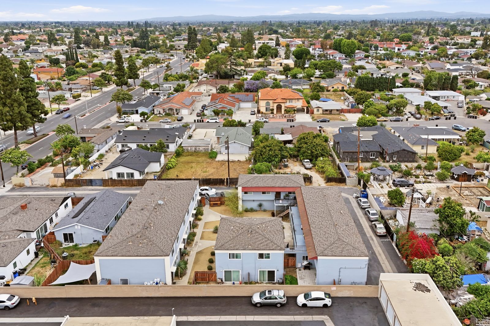Aerial view of the property and neighboring townhomes