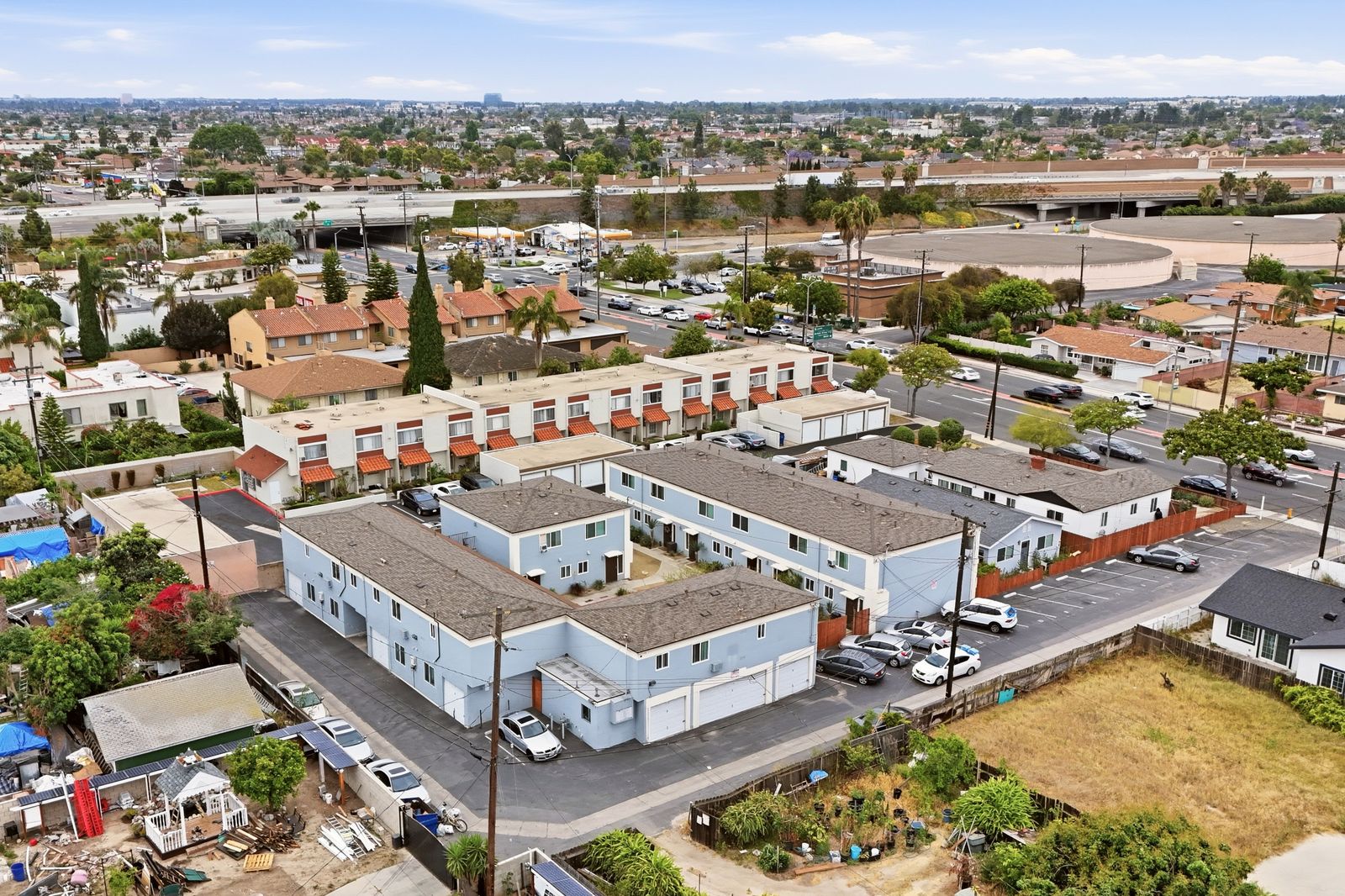 Aerial view of the property with the SR-22 freeway in the background