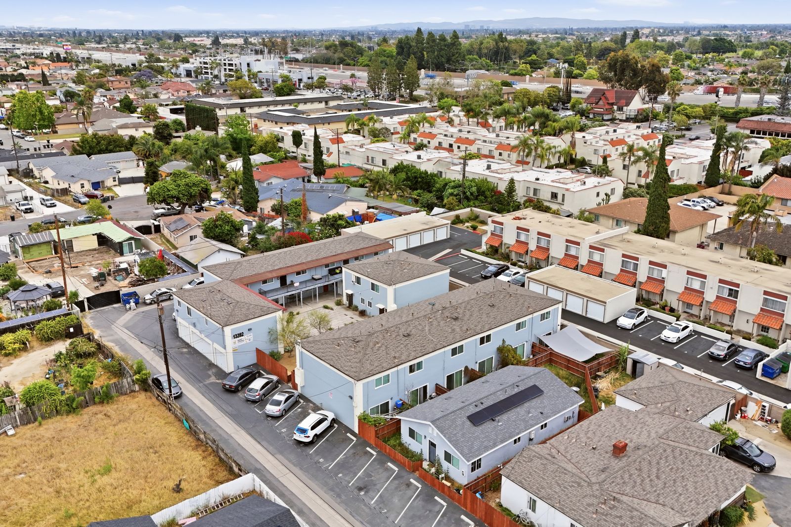 Aerial view of the property with mountain views in the distance