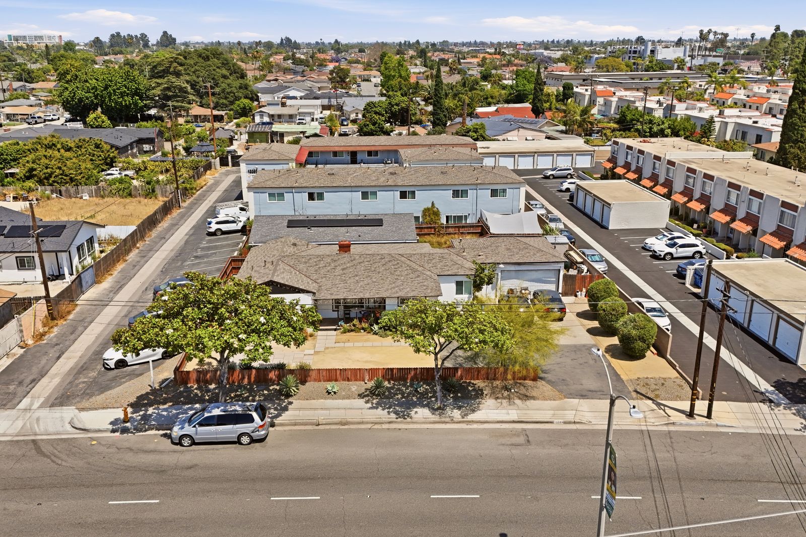 Aerial view of the property and surrounding neighborhood