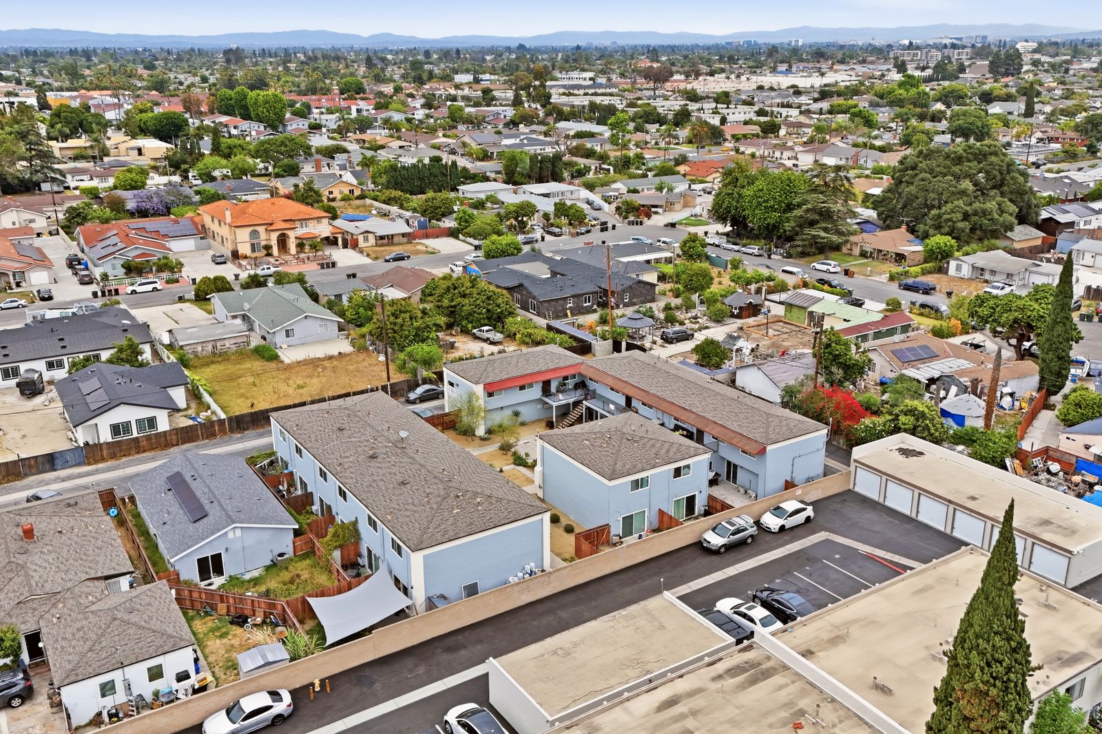 Wide aerial view of the property with mountains in the distance