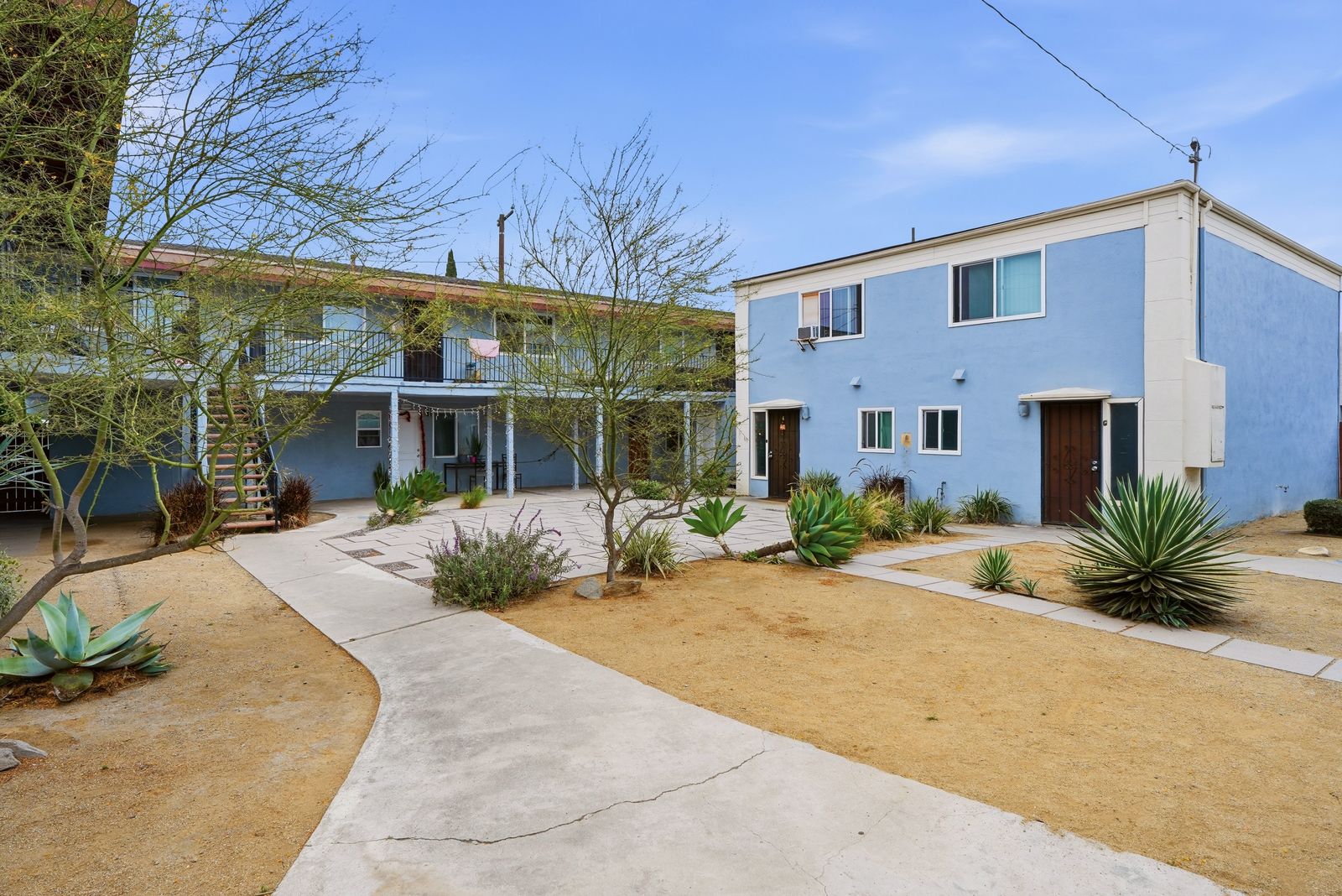 Courtyard with private entries and desert landscaping