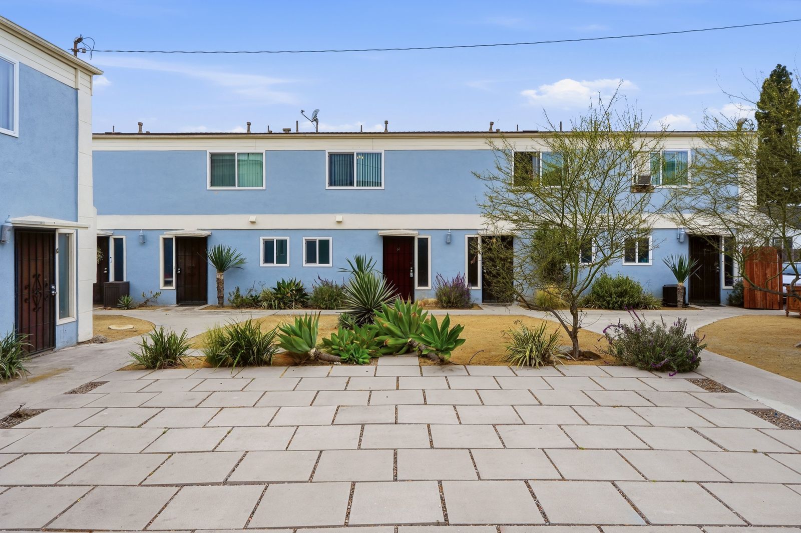 Courtyard view of the blue townhome row