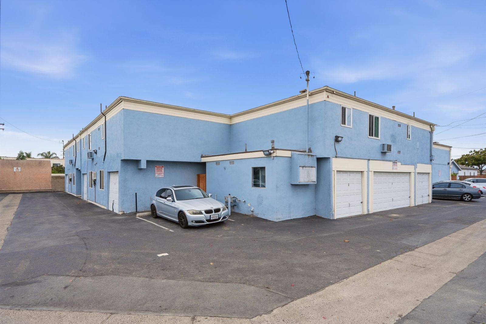 Exterior view of the building with gated parking