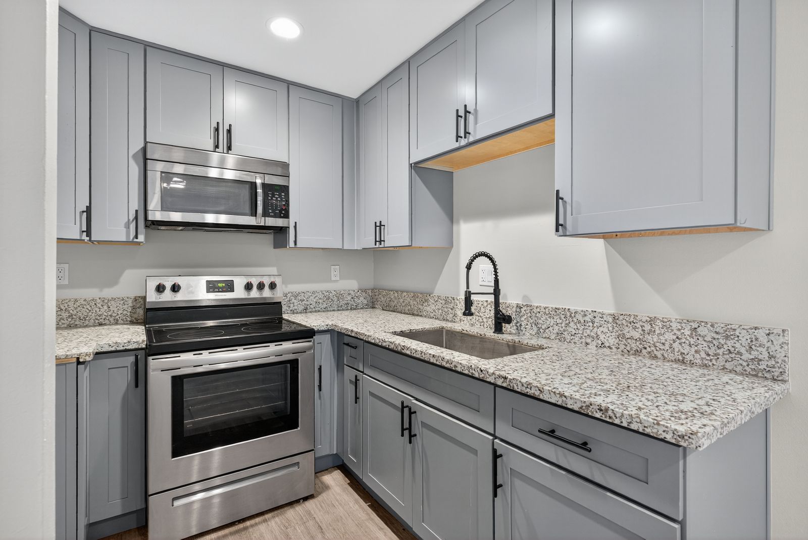 Renovated kitchen with granite countertops