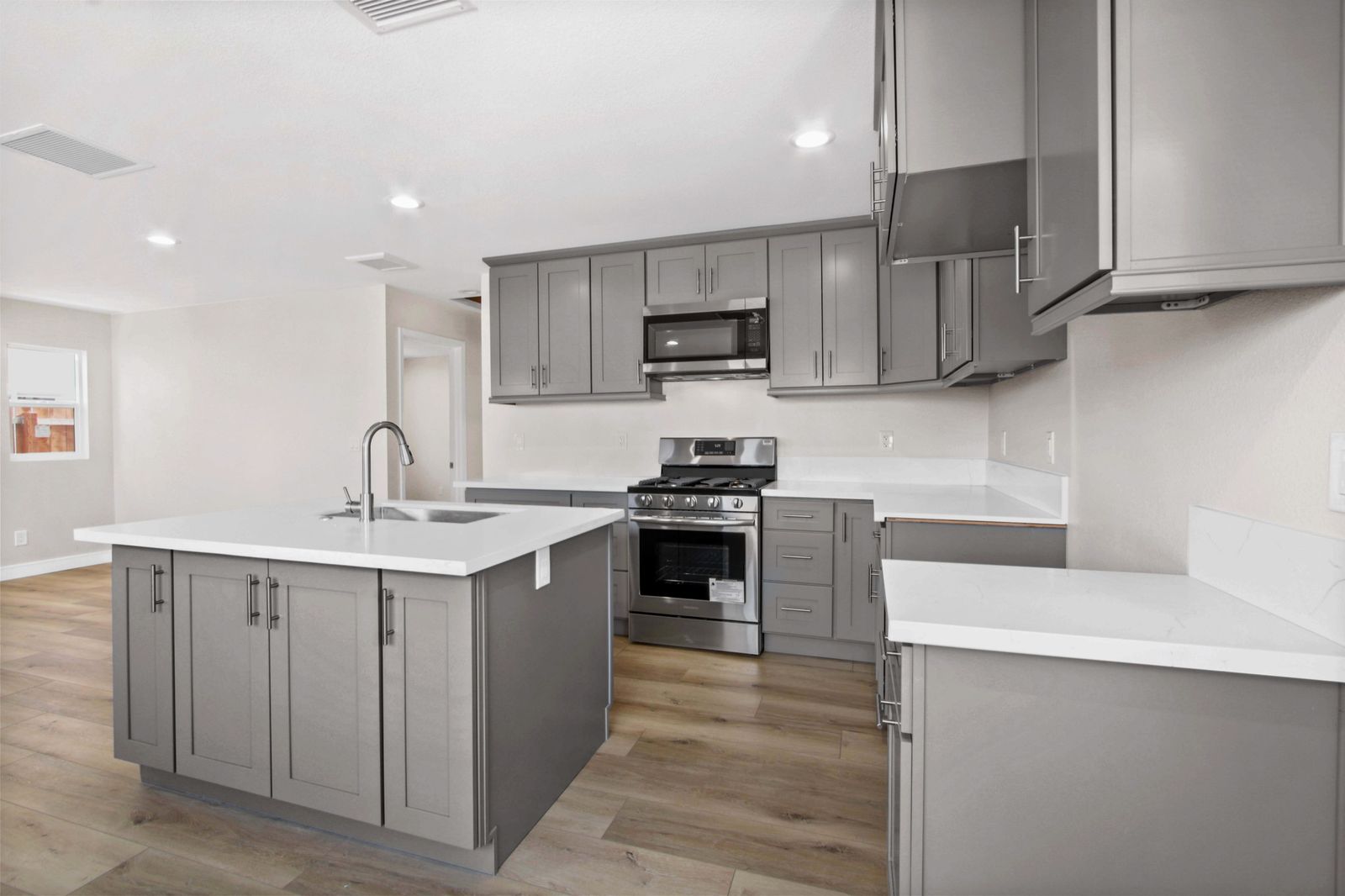 Renovated kitchen with quartz island